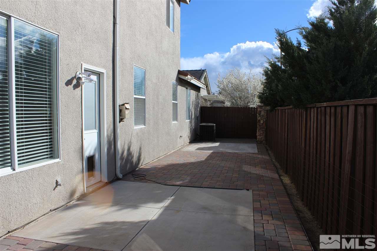 10409 Summershade Lane Reno, NV 89521 - Photo 17 of 22 a view of a house with backyard and a garden