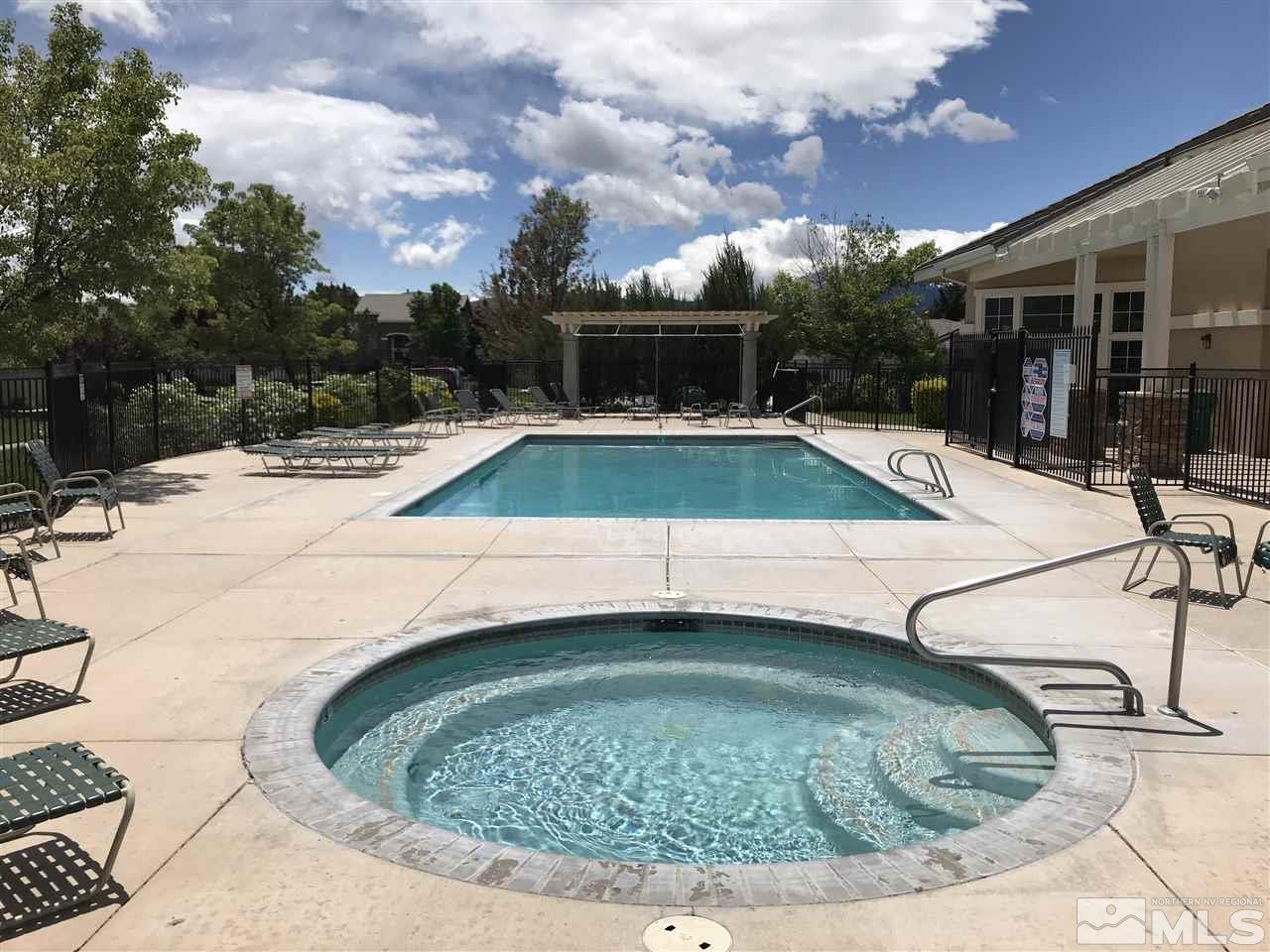 10409 Summershade Lane Reno, NV 89521 - Photo 18 of 22 a view of a swimming pool with a patio