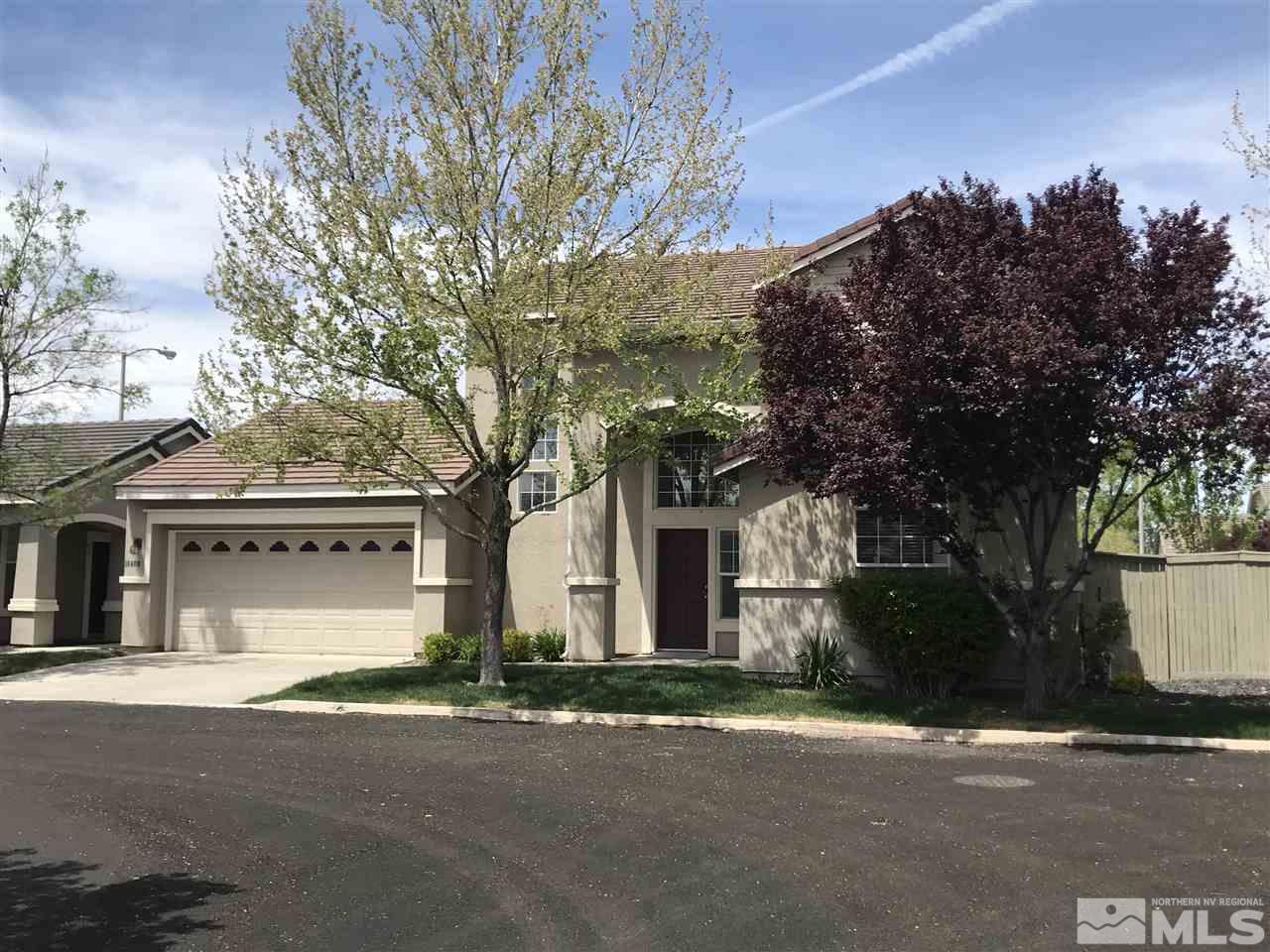 10409 Summershade Lane Reno, NV 89521 - Photo 2 of 22 a front view of a house with a yard and garage