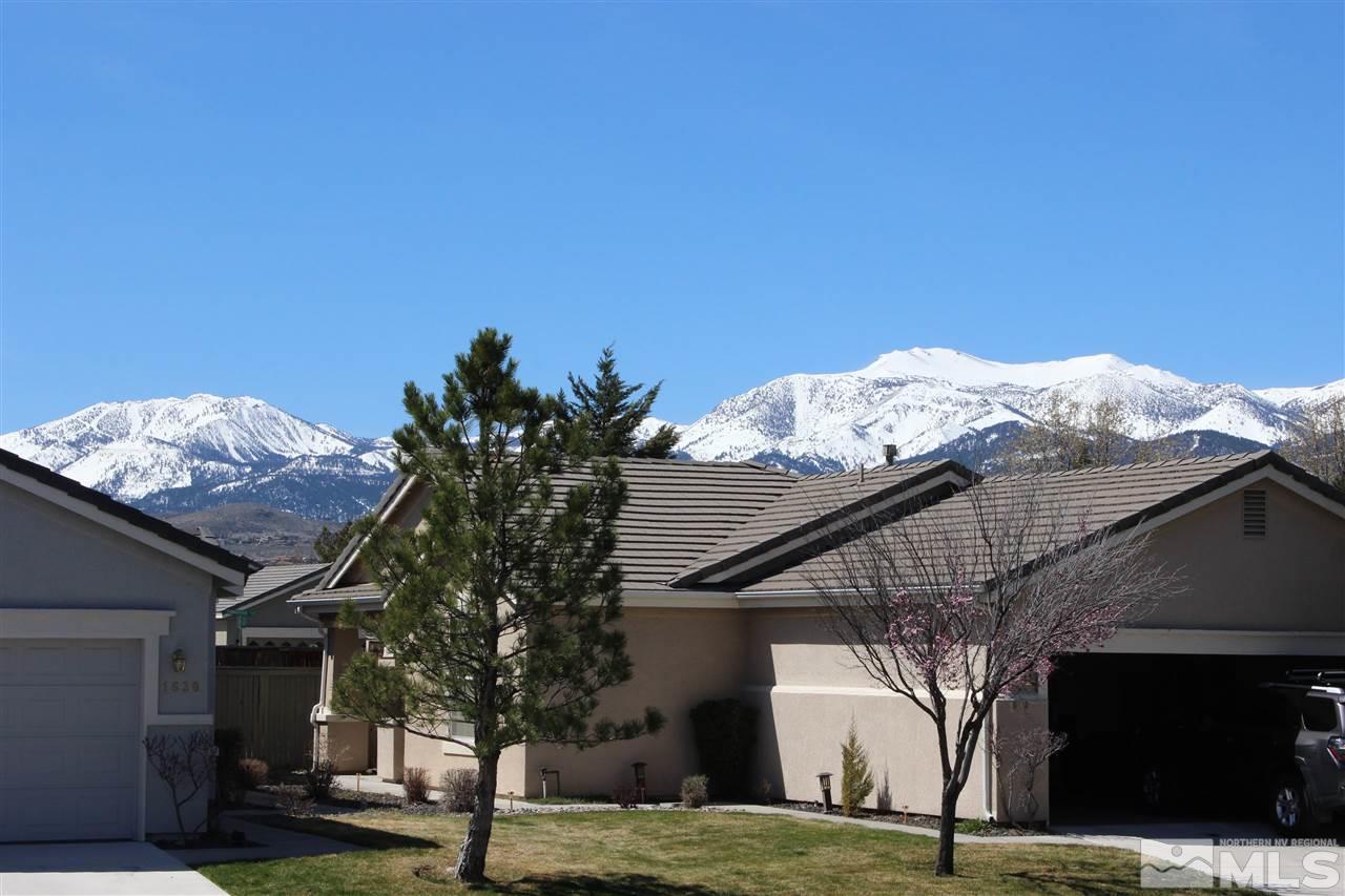 10409 Summershade Lane Reno, NV 89521 - Photo 22 of 22 a white house with a tree in the background