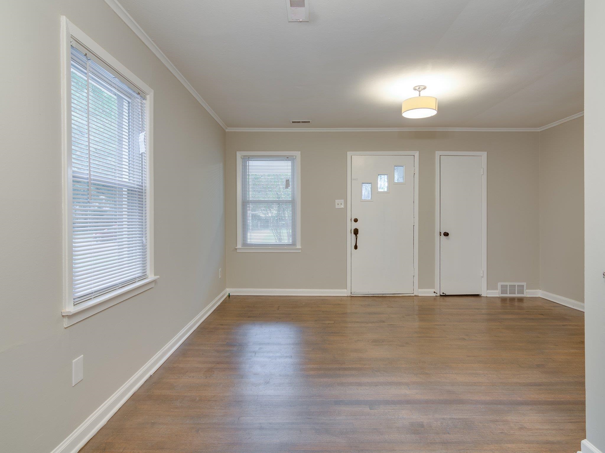 450 Homeville Road Collierville, TN 38017 - Photo 7 of 17 Foyer entrance featuring dark wood-type flooring and ornamental molding