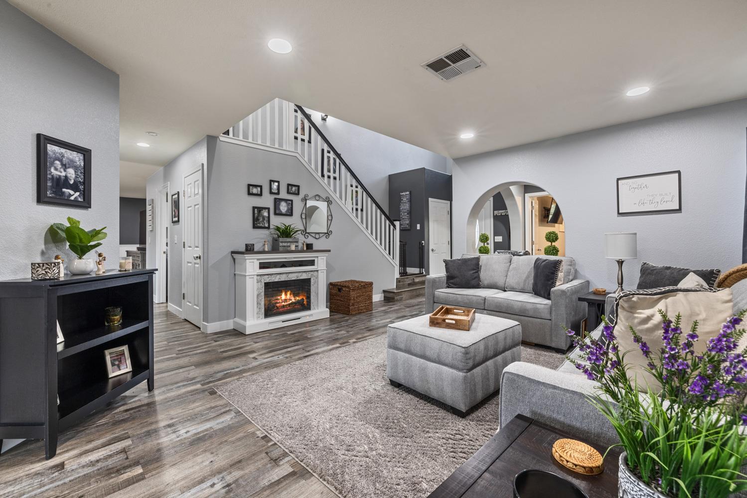 818 Travaille Way Ripon, CA 95366 - Photo 11 of 52 a living room with furniture and a fireplace