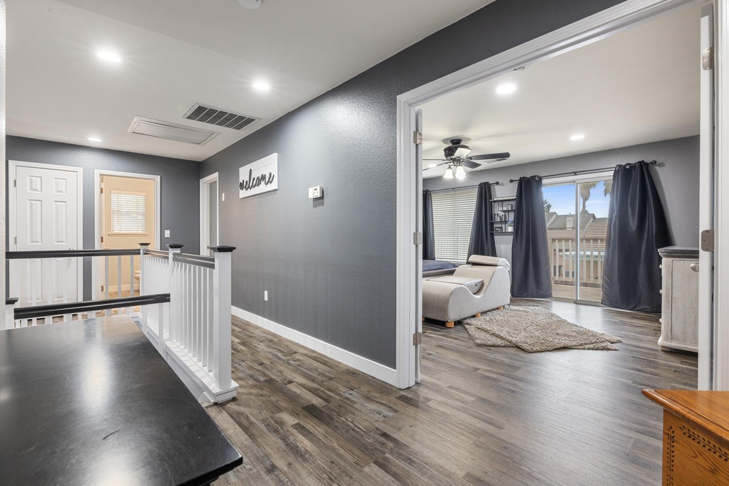 818 Travaille Way Ripon, CA 95366 - Photo 28 of 52 a view of a hallway view with wooden floor and staircase