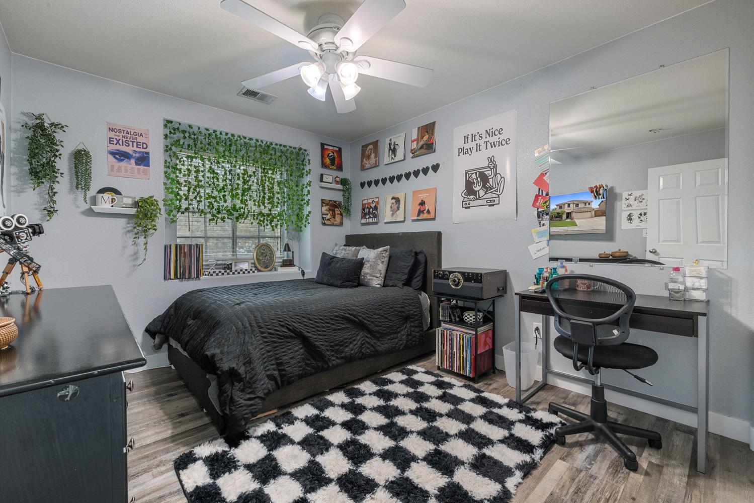 818 Travaille Way Ripon, CA 95366 - Photo 32 of 52 a bedroom with a bed and a chair