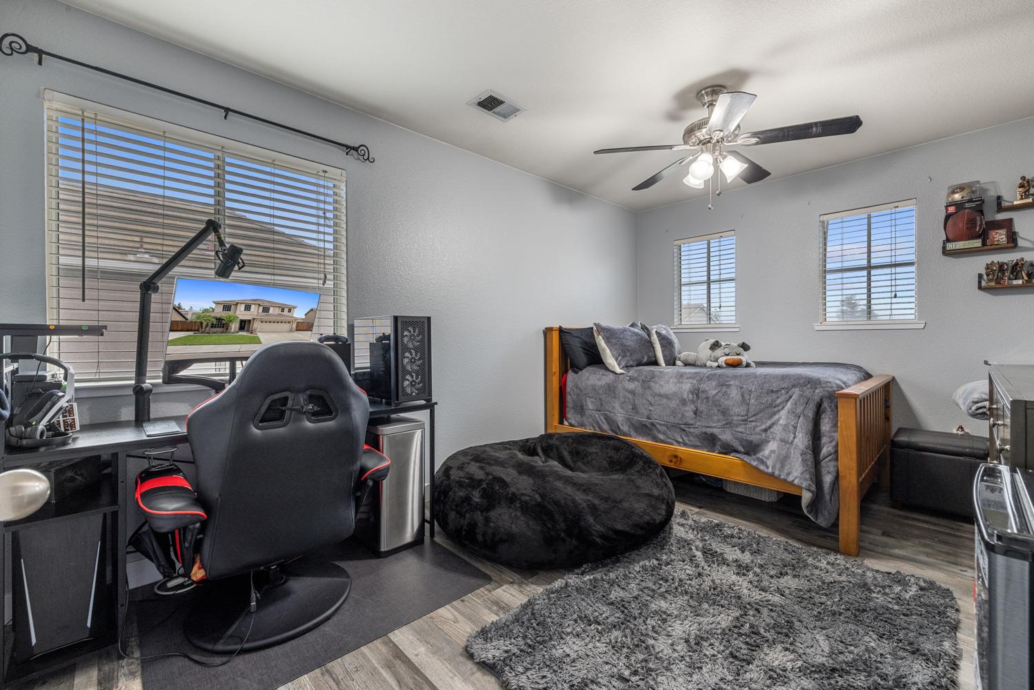 818 Travaille Way Ripon, CA 95366 - Photo 33 of 52 a bedroom with furniture and a window