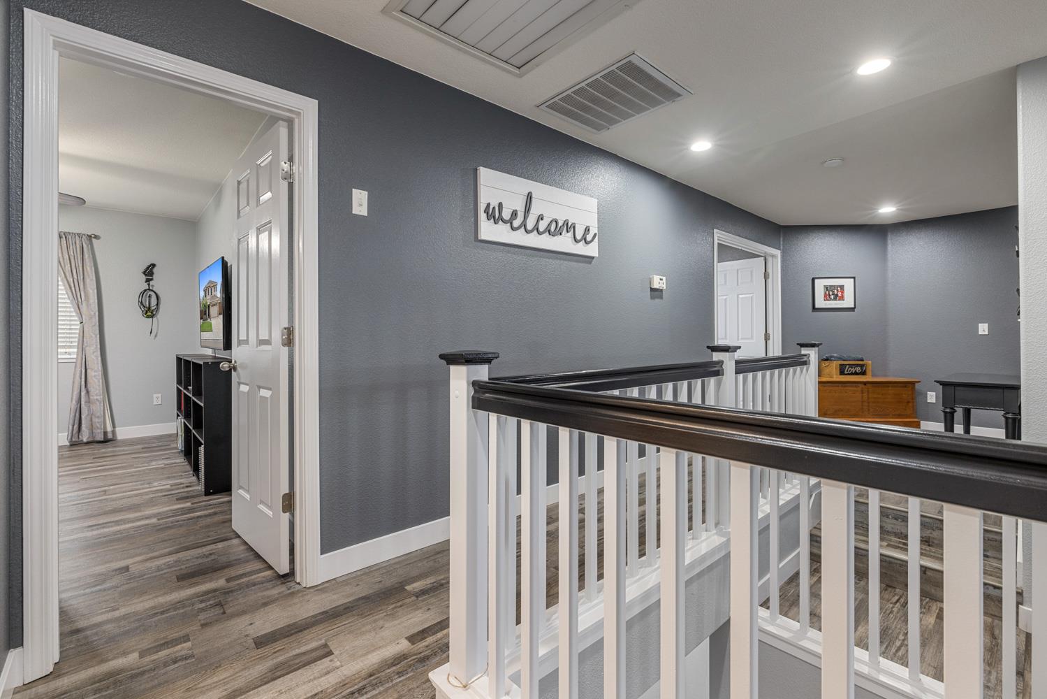 818 Travaille Way Ripon, CA 95366 - Photo 35 of 52 a view of a hallway with a livingroom with furniture