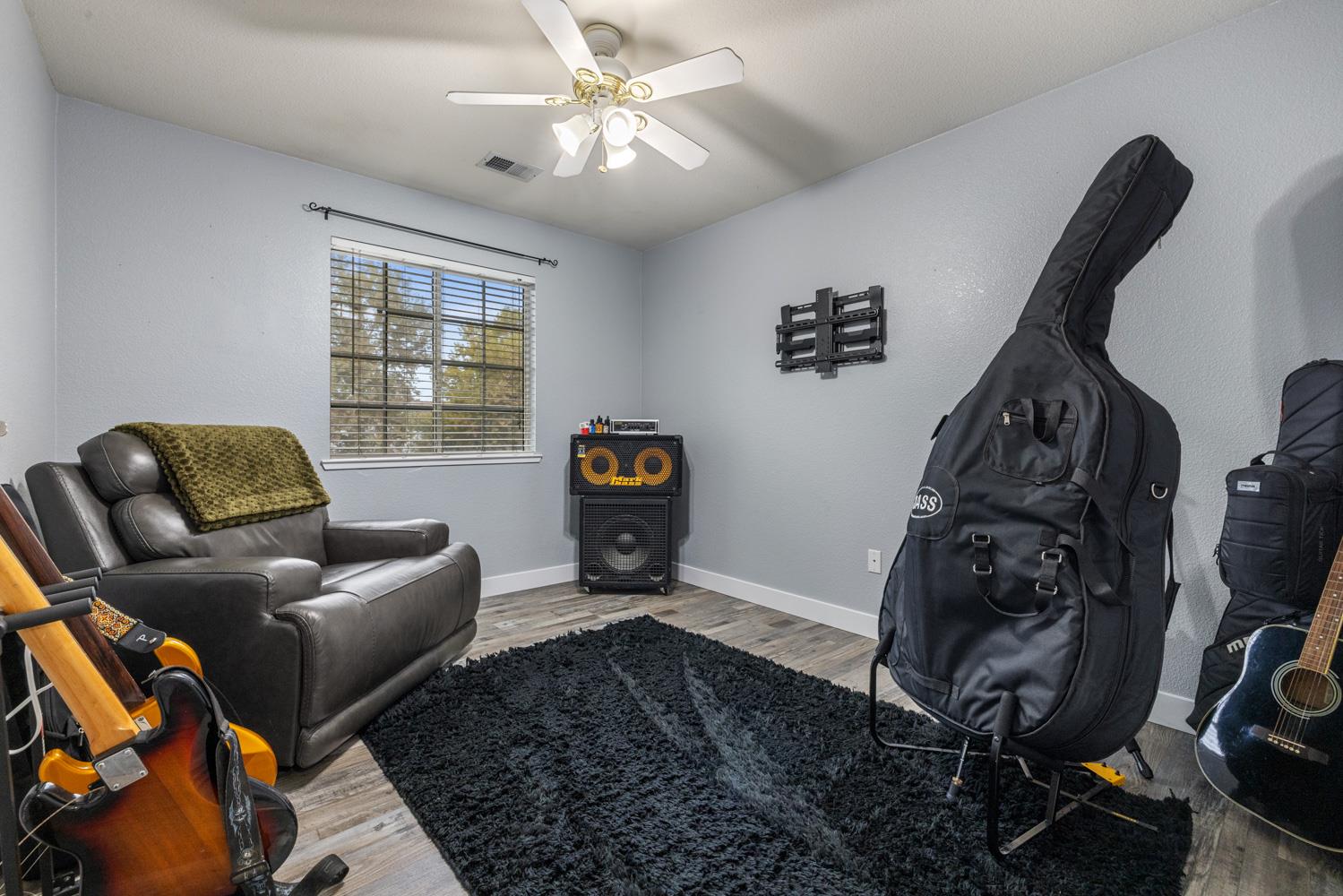 818 Travaille Way Ripon, CA 95366 - Photo 40 of 52 a living room with furniture and a window