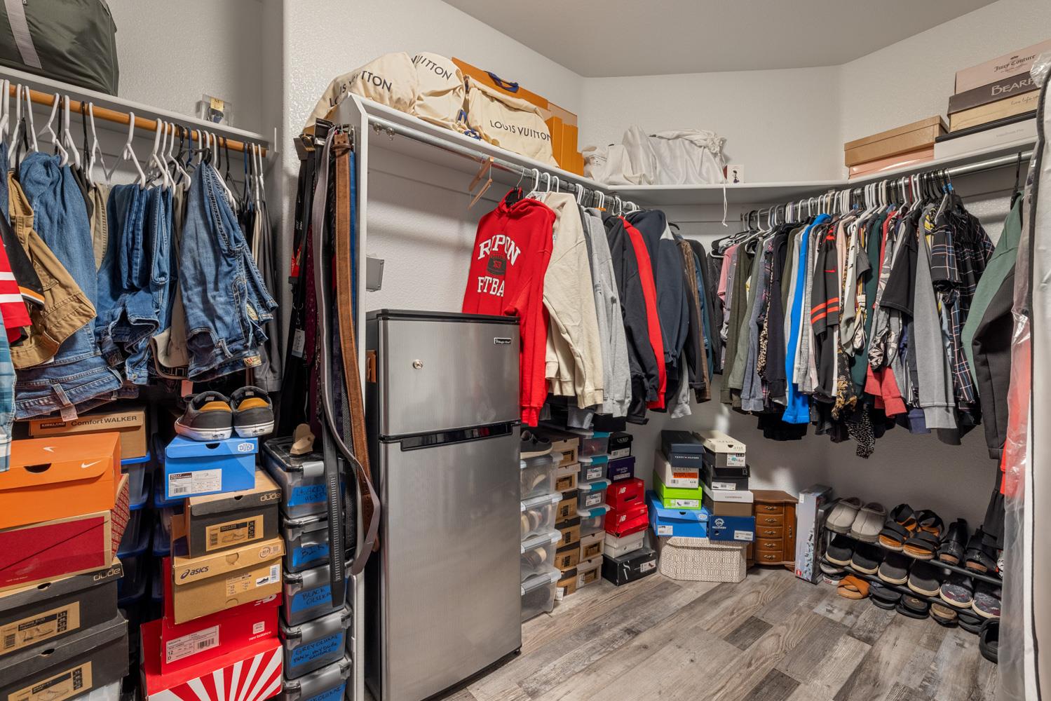 818 Travaille Way Ripon, CA 95366 - Photo 45 of 52 a view of walk in closet with clothes and shoes