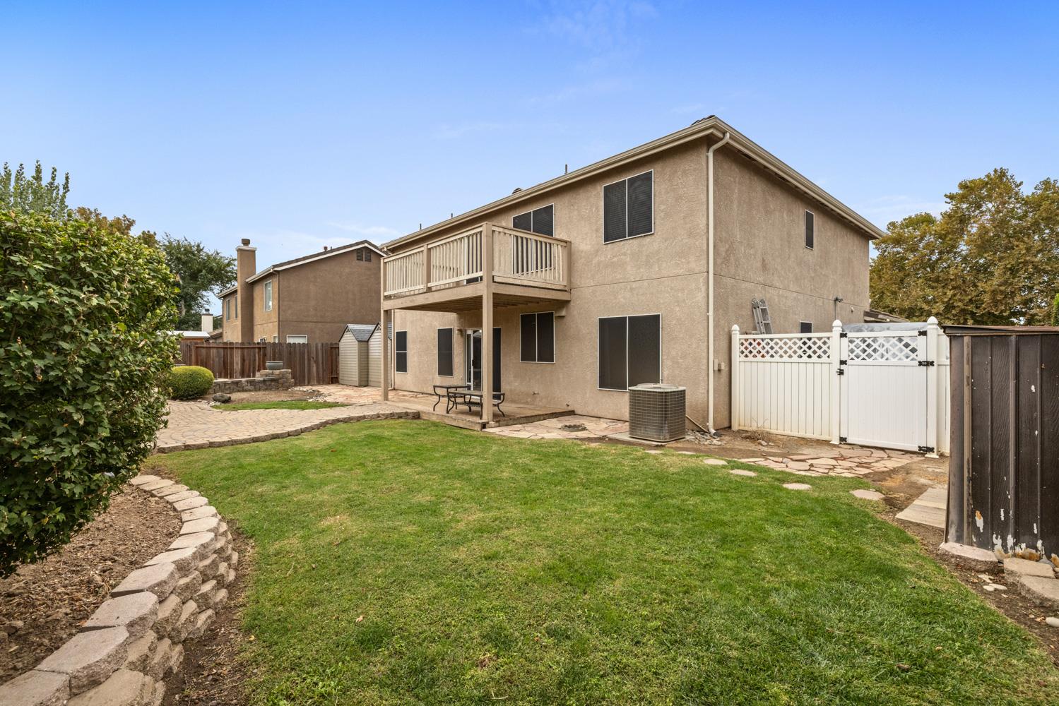 818 Travaille Way Ripon, CA 95366 - Photo 47 of 52 a front view of a house with a yard