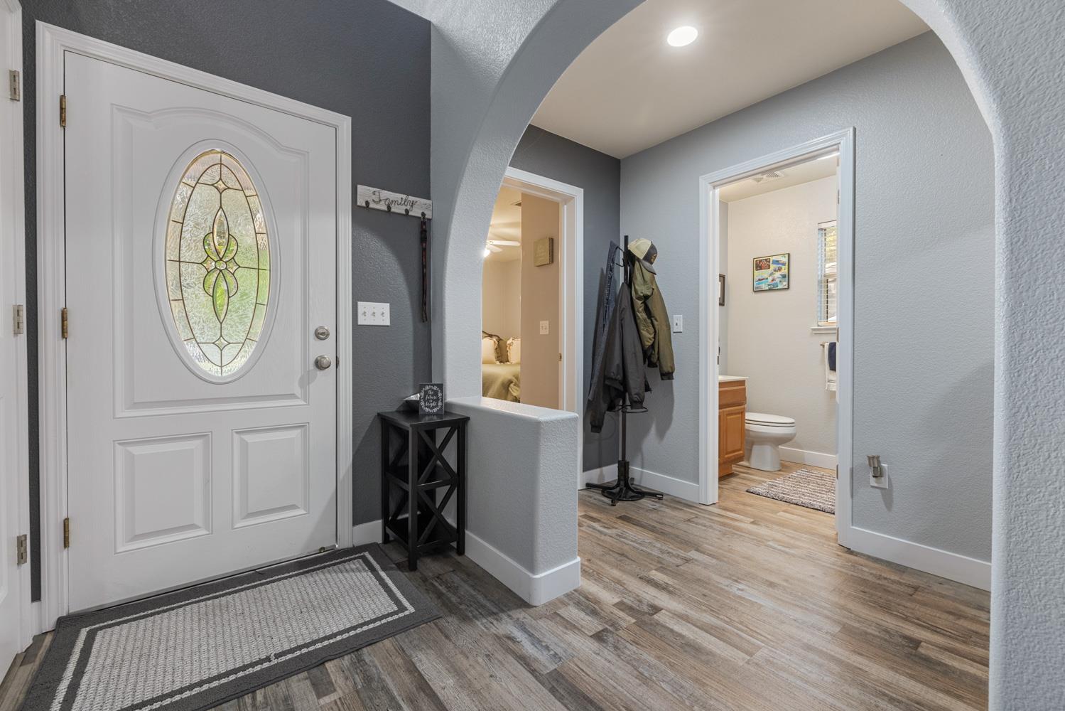 818 Travaille Way Ripon, CA 95366 - Photo 7 of 52 a view of hallway with wooden floor