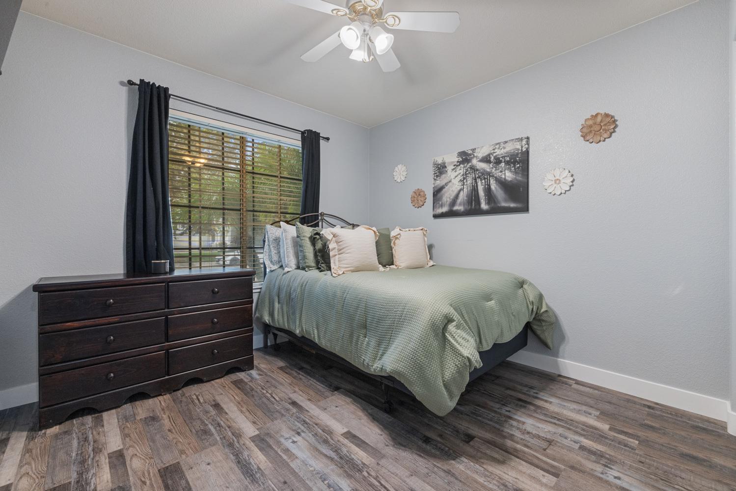 818 Travaille Way Ripon, CA 95366 - Photo 10 of 52 a bedroom with a bed and a window