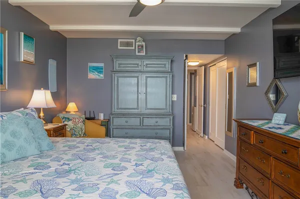 a bedroom with a bed and lamp