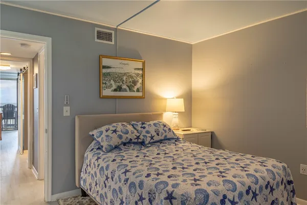 a bedroom with bed and window