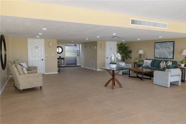 a view of a livingroom with furniture and a flat screen tv