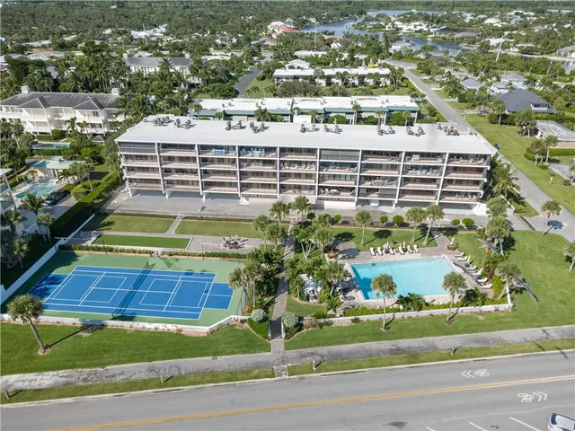 a view of a building with a yard