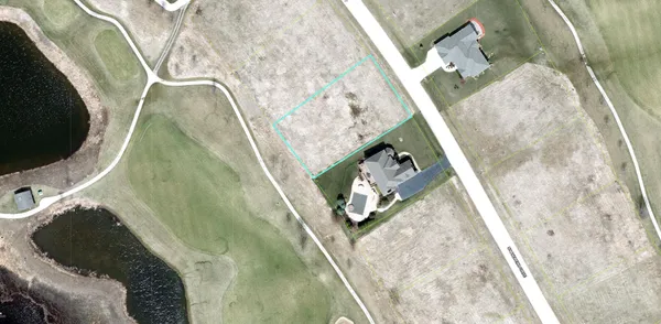 a view of a big yard with lots of green space