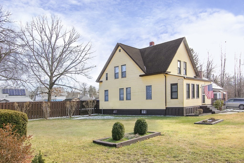 11 Benham Street Springfield, MA 01109 - Photo 1 of 12 a view of a house with a yard and sitting area