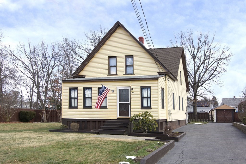11 Benham Street Springfield, MA 01109 - Photo 2 of 12 a front view of a house with a yard