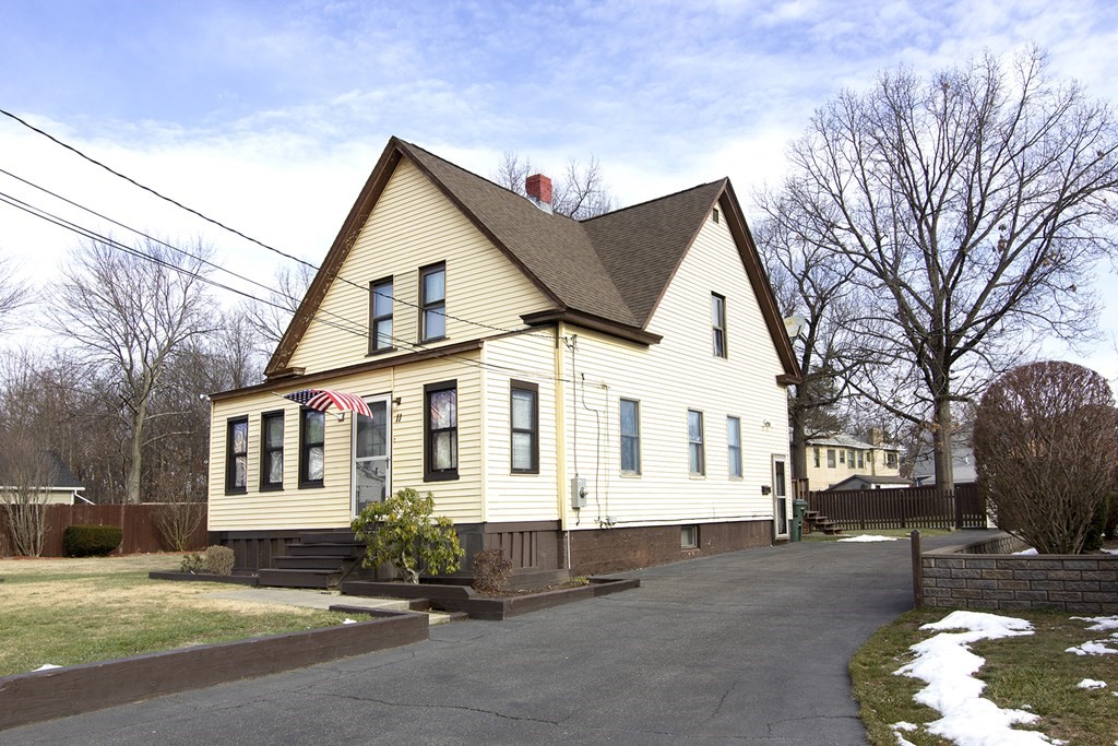 11 Benham Street Springfield, MA 01109 - Photo 3 of 12 a view of a white house with a yard and large tree