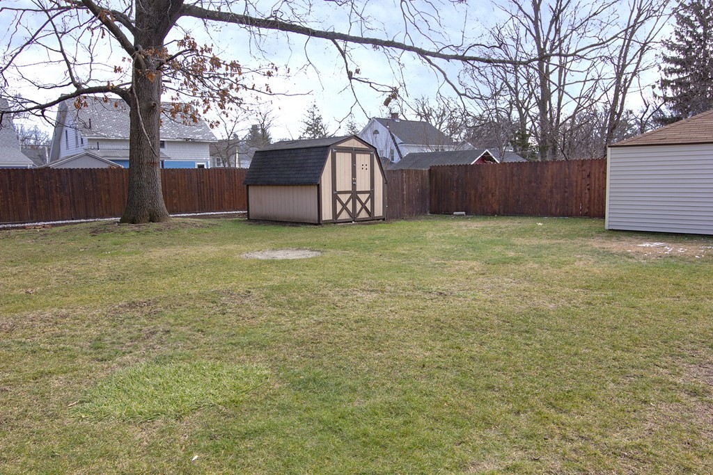 11 Benham Street Springfield, MA 01109 - Photo 4 of 12 a backyard of a house with lots of green space