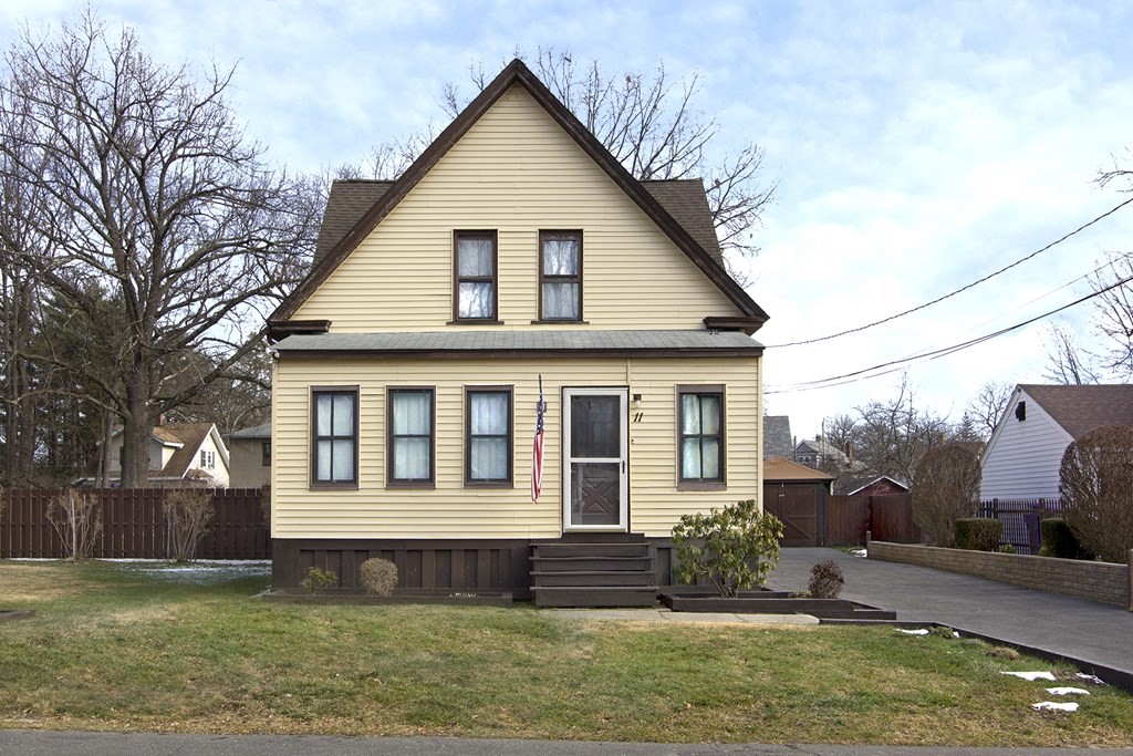 11 Benham Street Springfield, MA 01109 - Photo 5 of 12 a front view of a house with a yard