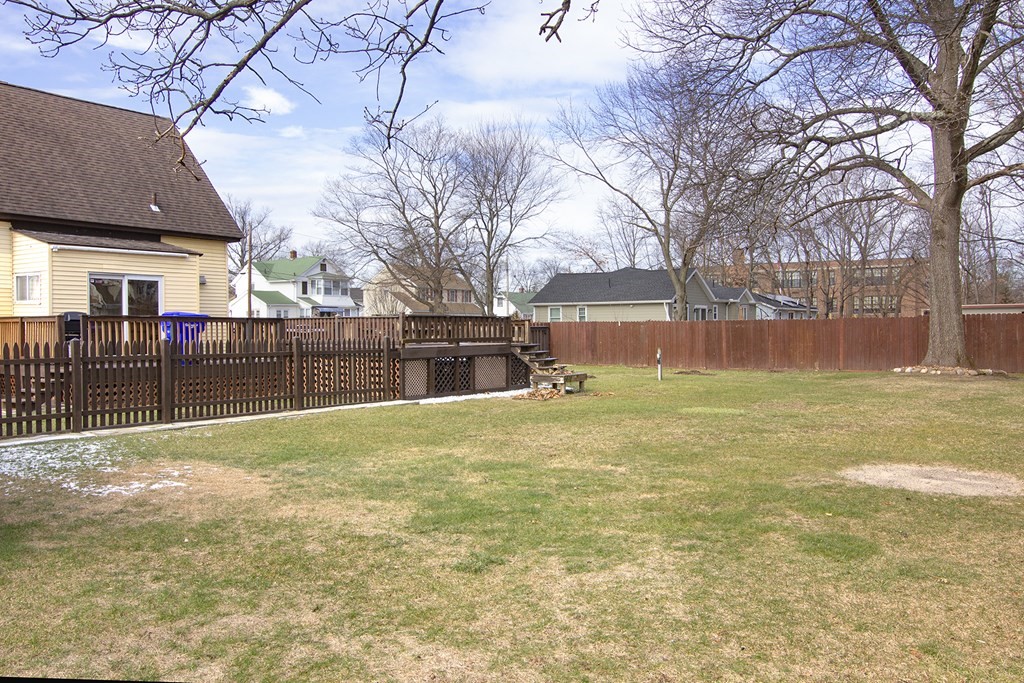 11 Benham Street Springfield, MA 01109 - Photo 7 of 12 a backyard of a house with table and chairs