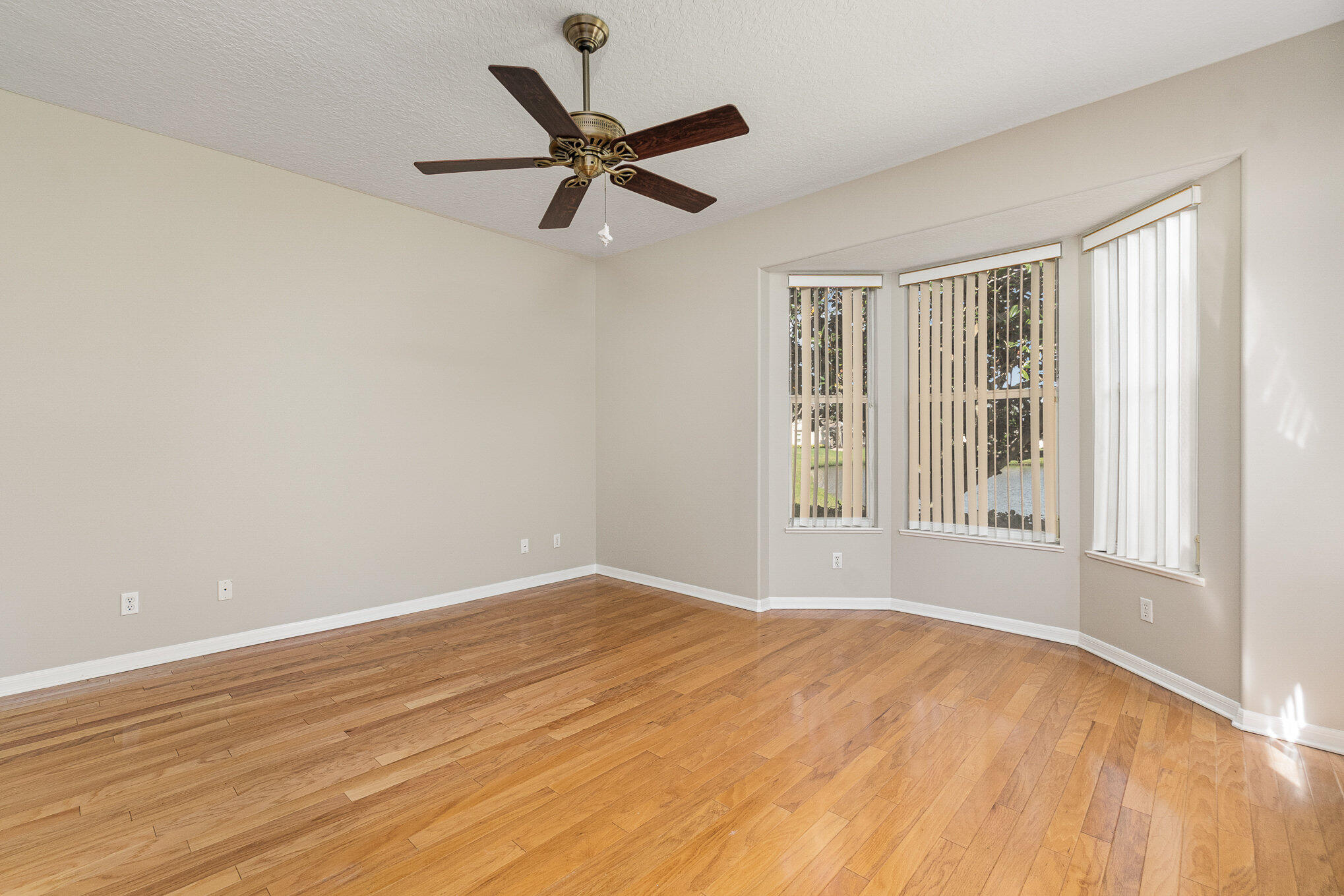 4370 Aberdeen Circle Rockledge, FL 32955 - Photo 12 of 33 a view of a big room with wooden floor and windows