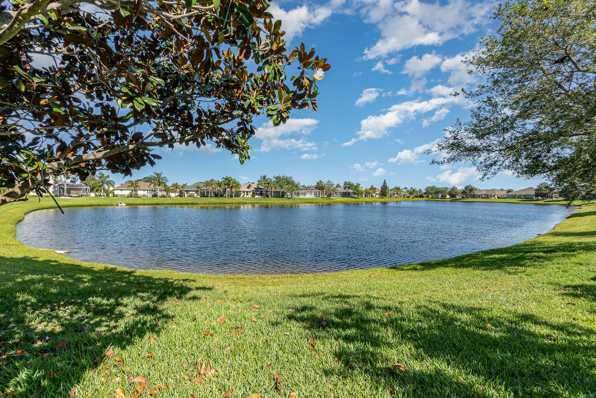 4370 Aberdeen Circle Rockledge, FL 32955 - Photo 22 of 33 a view of a lake with houses in the back