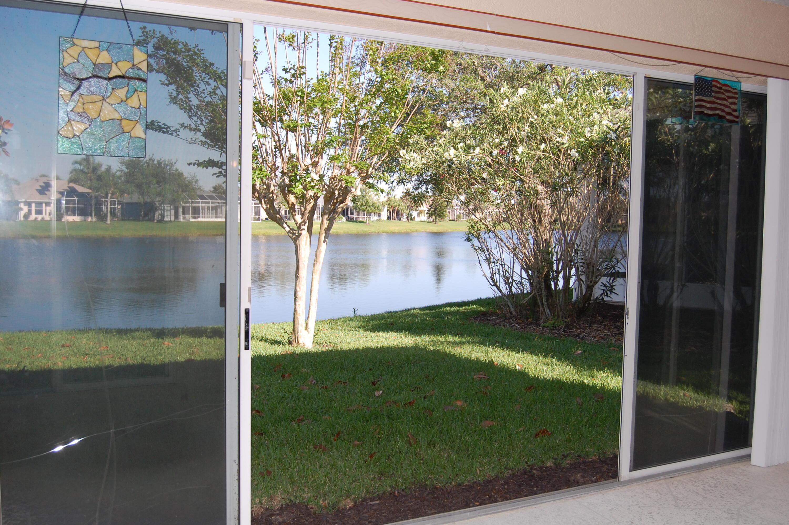 4370 Aberdeen Circle Rockledge, FL 32955 - Photo 28 of 33 a backyard of a house with lots of green space and plants