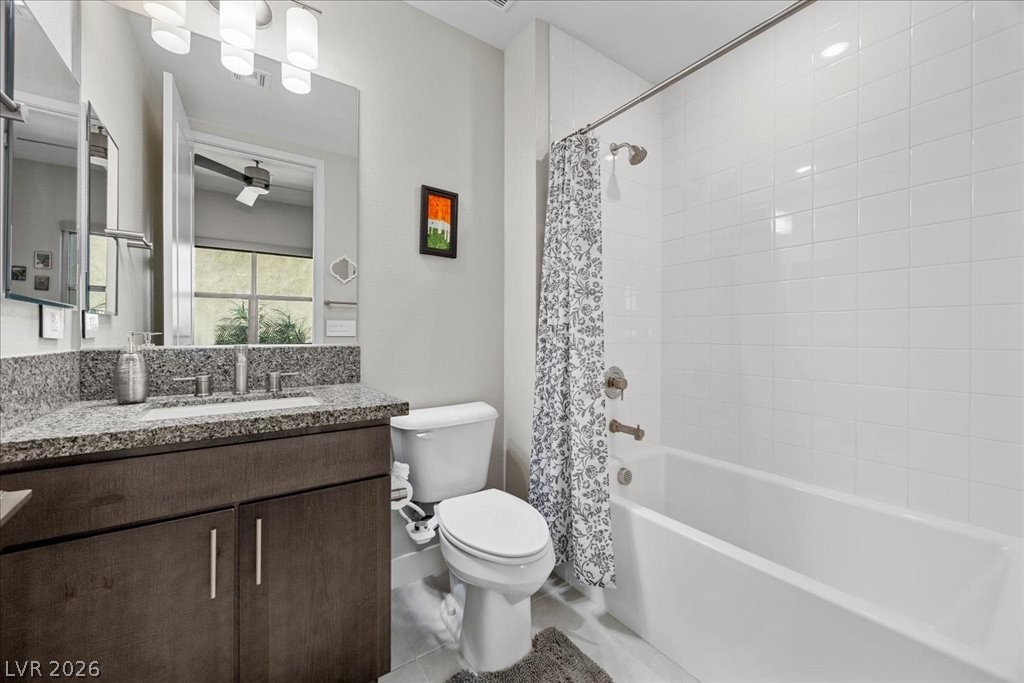 4262 Swift Street Las Vegas, NV 89135 - Photo 26 of 75 Bathroom featuring vanity, shower / tub combo, and light tile patterned floors