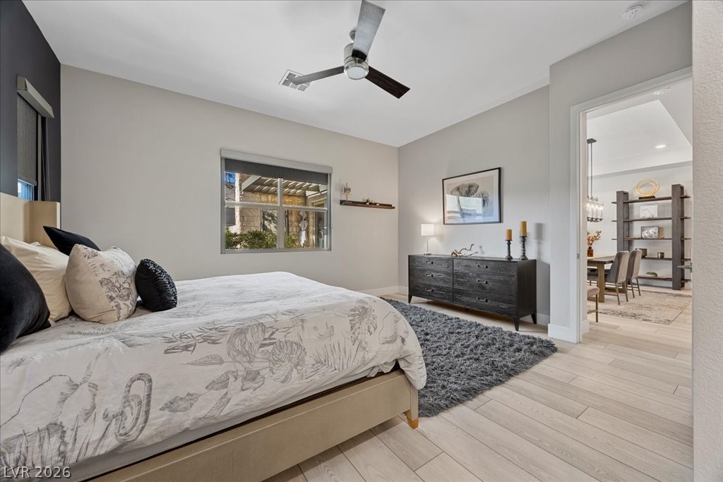 4262 Swift Street Las Vegas, NV 89135 - Photo 30 of 75 Bedroom featuring wood finished floors and ceiling fan