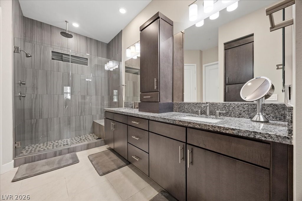 4262 Swift Street Las Vegas, NV 89135 - Photo 31 of 75 Bathroom with double vanity, a stall shower, light tile patterned floors, and recessed lighting