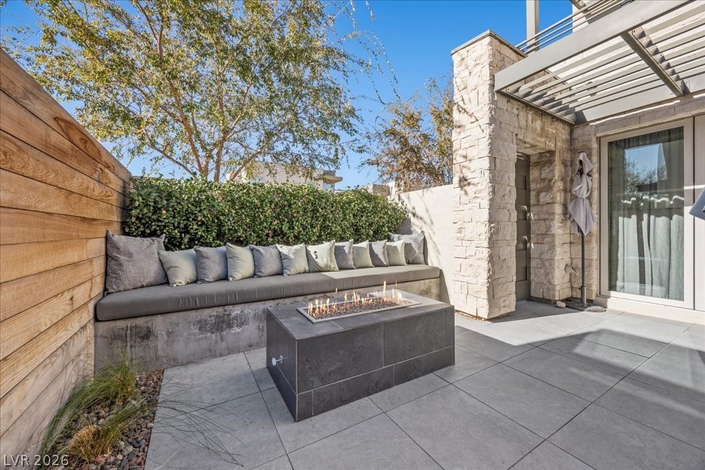 4262 Swift Street Las Vegas, NV 89135 - Photo 5 of 75 View of patio with an outdoor fire pit