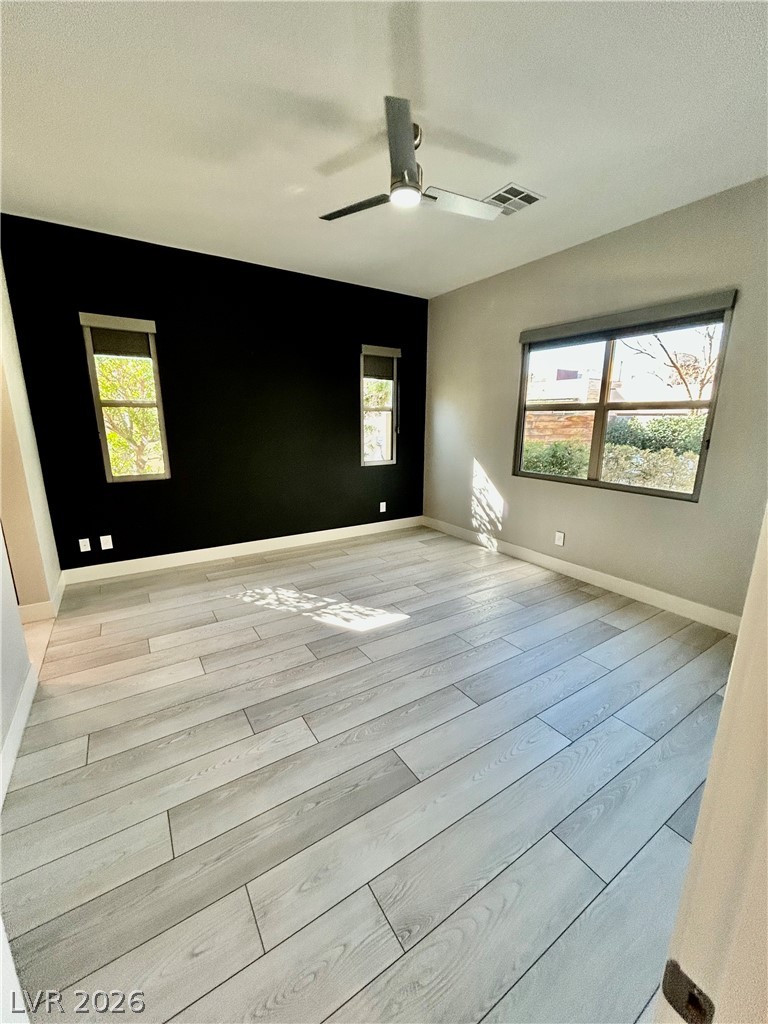 4262 Swift Street Las Vegas, NV 89135 - Photo 58 of 75 Bedoom with light wood-type flooring, a textured ceiling, and ceiling fan