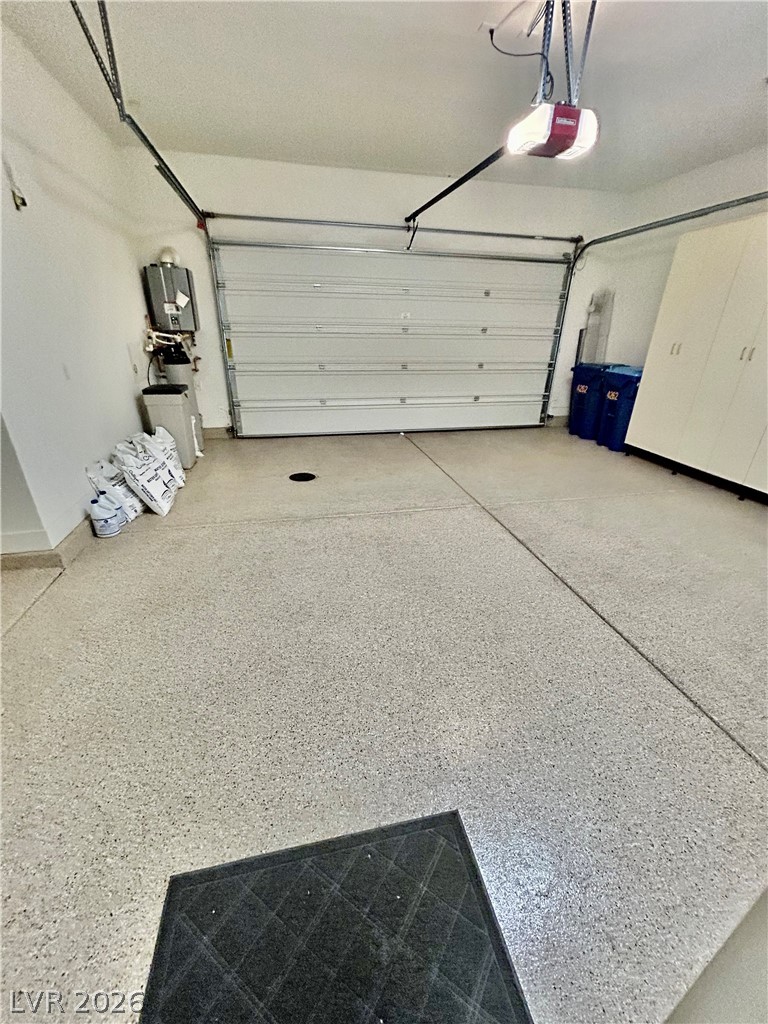 4262 Swift Street Las Vegas, NV 89135 - Photo 66 of 75 Garage featuring a garage door opener