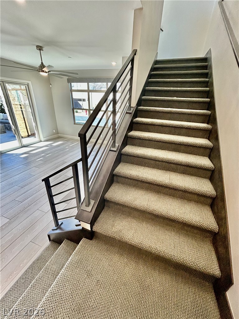 4262 Swift Street Las Vegas, NV 89135 - Photo 68 of 75 Stairway featuring ceiling fan, hardwood / wood-style floors, and recessed lighting