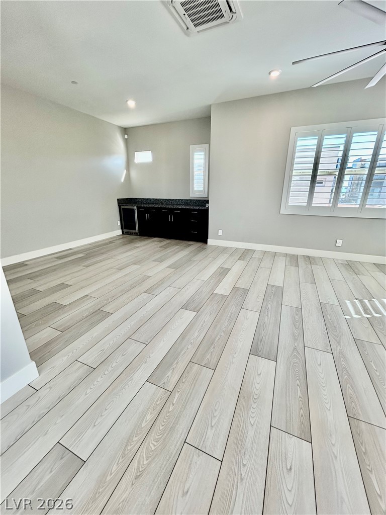 4262 Swift Street Las Vegas, NV 89135 - Photo 70 of 75 Spare room with light wood finished floors, cooling unit, and ceiling fan