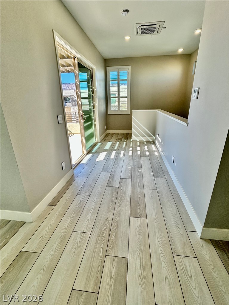 4262 Swift Street Las Vegas, NV 89135 - Photo 72 of 75 Hall featuring light wood-style flooring, cooling unit, and recessed lighting
