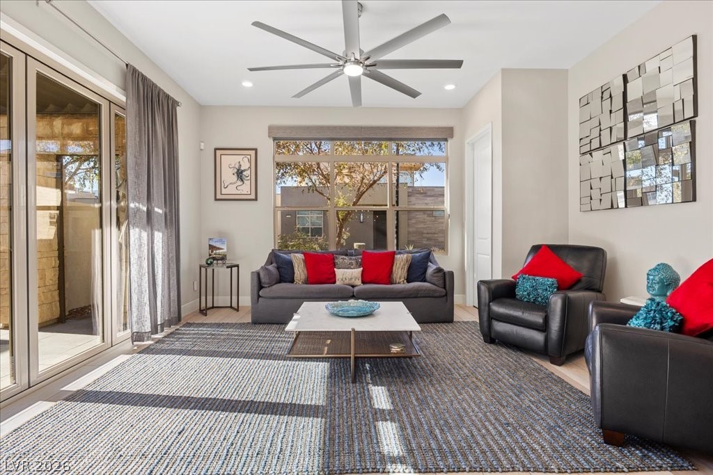 4262 Swift Street Las Vegas, NV 89135 - Photo 10 of 75 Living area featuring wood finished floors, a ceiling fan, and recessed lighting