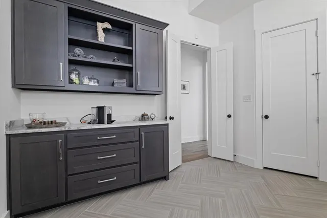 a view of wooden cabinets and dresser