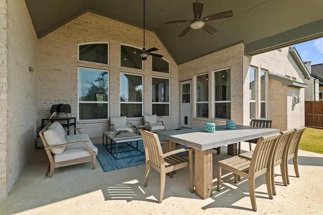 a outdoor space with lots of white furniture