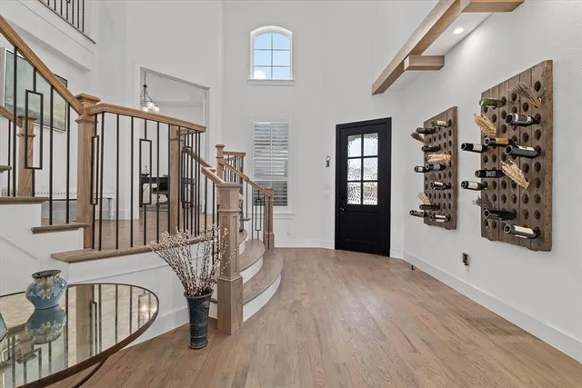 a view of entryway with stairs and wooden floor