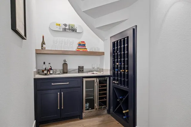 a kitchen with stainless steel appliances a sink and cabinets