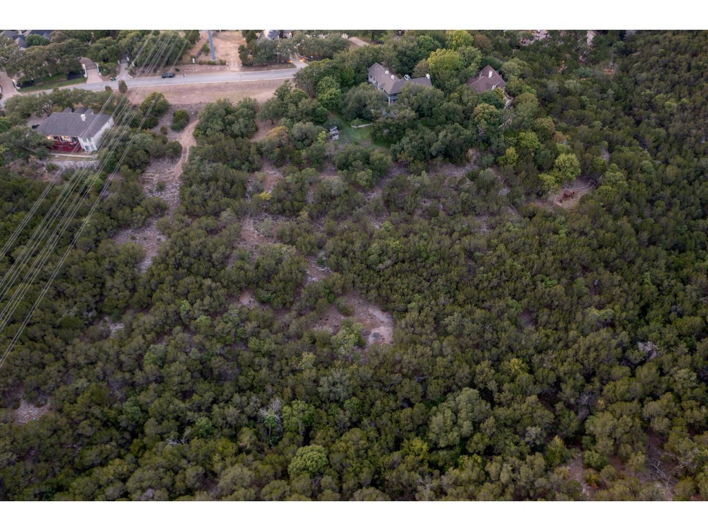 539 Beardsley Lane Austin, TX 78746 - Photo 13 of 24 a view of a field with trees in background