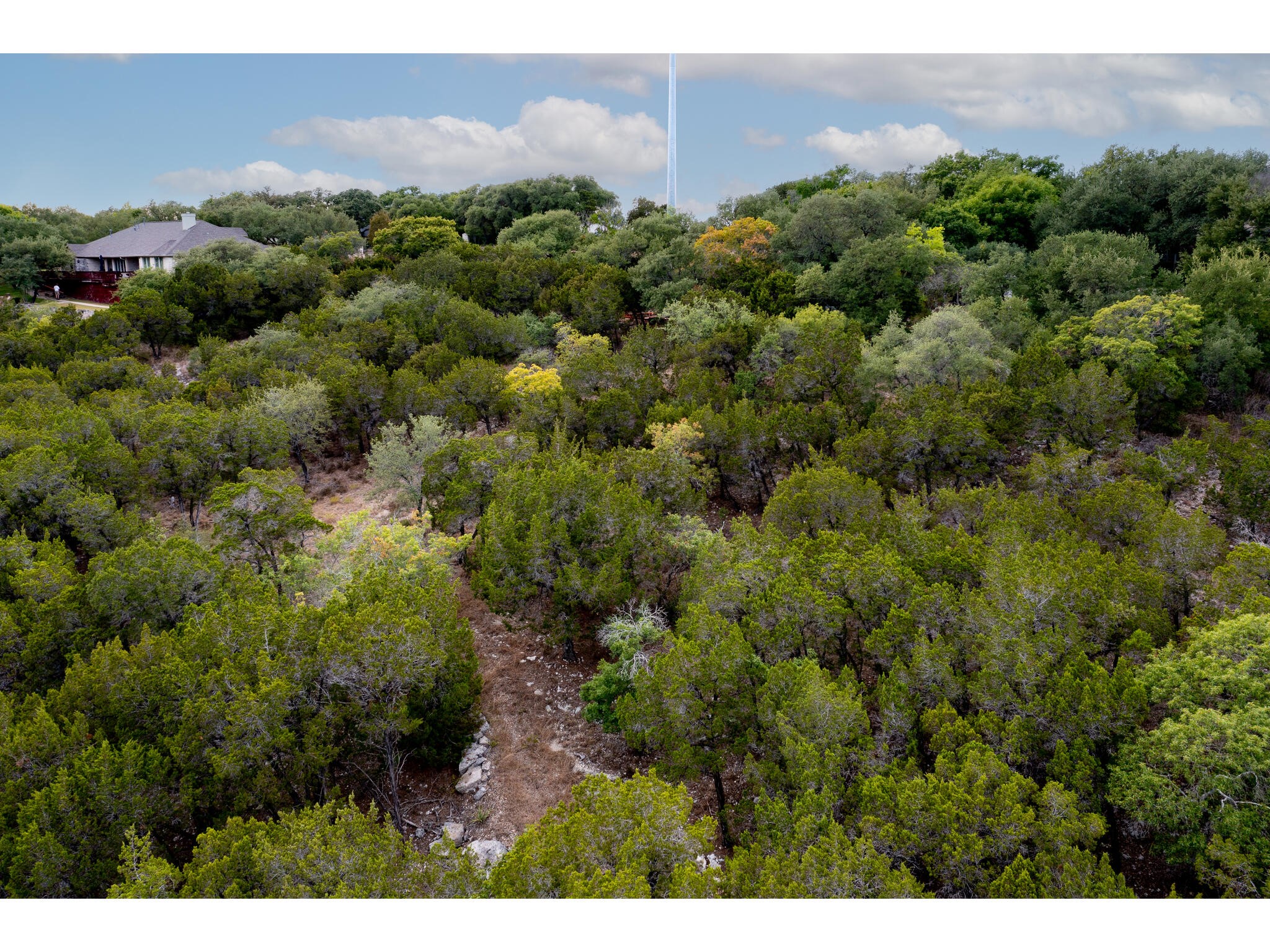 539 Beardsley Lane Austin, TX 78746 - Photo 18 of 24 a view of a city with a building