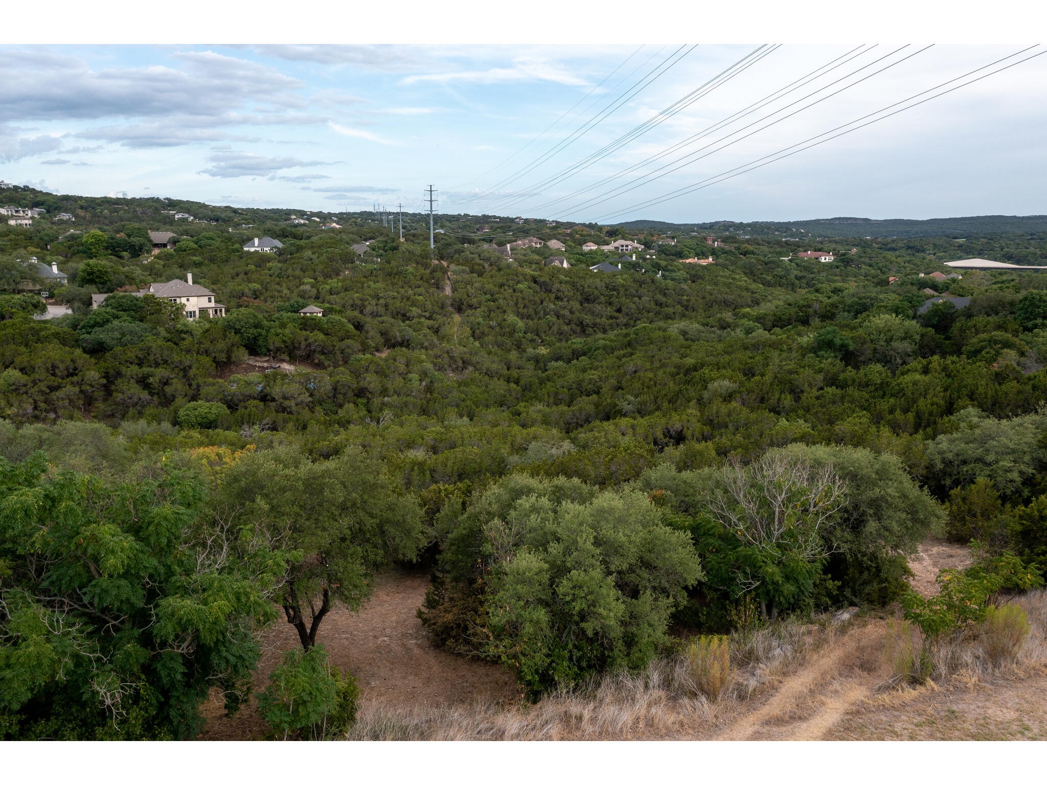 539 Beardsley Lane Austin, TX 78746 - Photo 20 of 24 a view of a city and mountains in a background