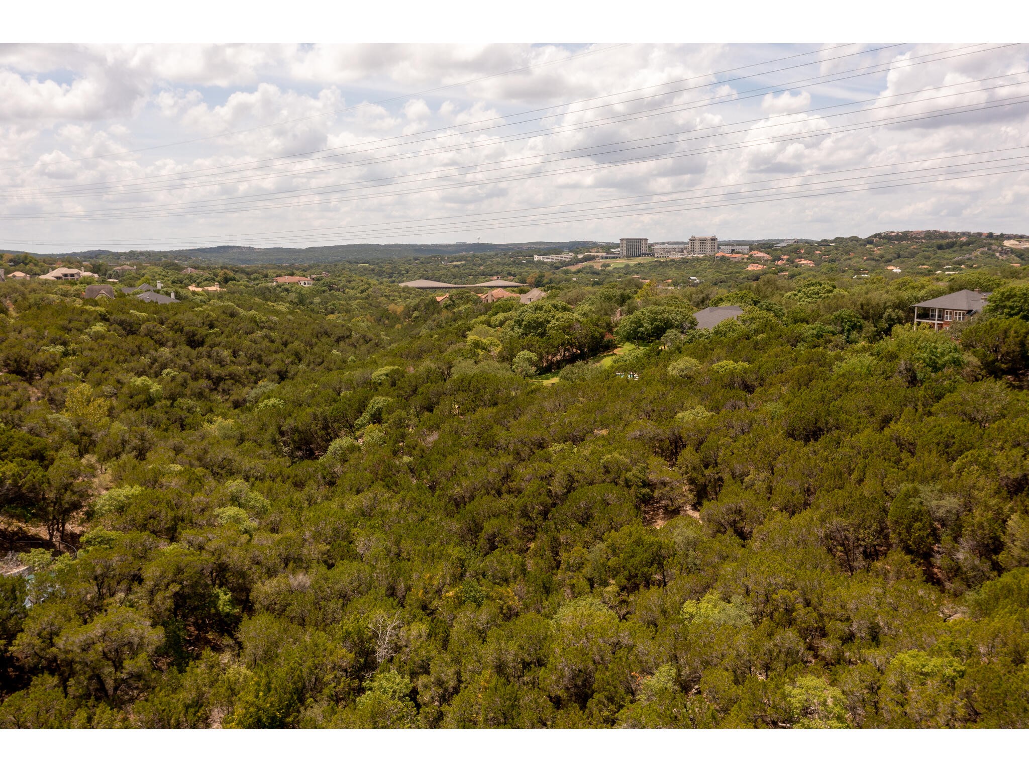 539 Beardsley Lane Austin, TX 78746 - Photo 2 of 24 a view of a green field