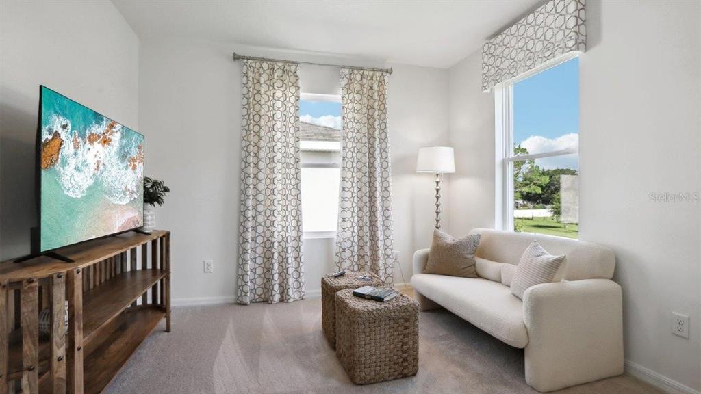 2425 Stratten Drive Zephyrhills, FL 33541 - Photo 25 of 28 a living room with furniture and a window