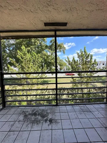 a view of a wooden bench in a balcony