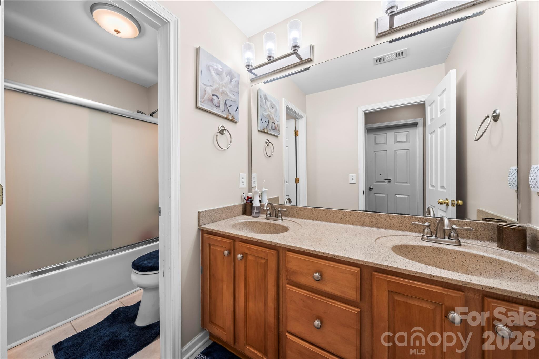 3715 Messina Road Clover, SC 29710 - Photo 20 of 33 a spacious bathroom with a granite countertop sink and a mirror
